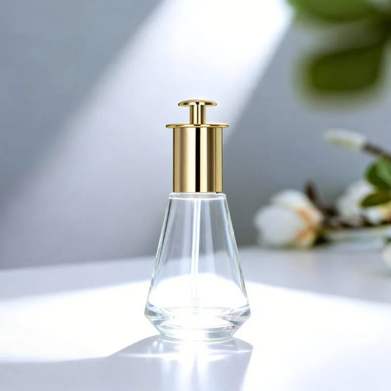 clear glass essential oil bottle with gold cap