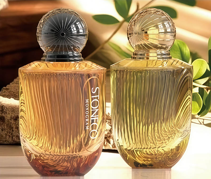 Luxurious transparent blue tinted glass perfume bottle with pump mechanism